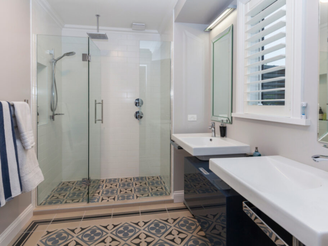 bathroom with two hand basins on right