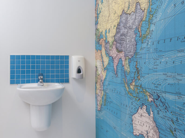 toilet with a wide scale of map on the right side